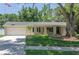 Charming single-story home with a well-manicured lawn and a two-car garage at 606 Brentwood Pl, Brandon, FL 33511