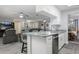 Bright kitchen boasts granite counters, stainless appliances, and opens to the dining & living area at 606 Brentwood Pl, Brandon, FL 33511