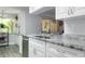 Bright kitchen features granite counters, stainless appliances and ample storage space at 606 Brentwood Pl, Brandon, FL 33511