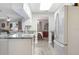 Well-lit kitchen showcases granite countertops and opens up to the dining and living room areas at 606 Brentwood Pl, Brandon, FL 33511
