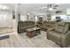Open-concept living room with comfortable seating and stylish furniture at 606 Brentwood Pl, Brandon, FL 33511