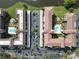 Panoramic aerial shot showcasing the condo community with pools, parking, landscaping, and multiple residential buildings at 6150 Gulfport S Blvd # 302, Gulfport, FL 33707