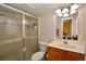Bathroom with a glass shower and a wood vanity at 6150 Gulfport S Blvd # 302, Gulfport, FL 33707