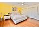 Bedroom featuring hardwood floors, ceiling fan, closets, and neutral color scheme at 6150 Gulfport S Blvd # 302, Gulfport, FL 33707