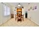 Inviting dining room adjacent to kitchen with tile flooring, modern decor, and natural light at 6150 Gulfport S Blvd # 302, Gulfport, FL 33707