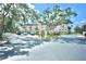 Attractive building with convenient parking and lush trees and landscaping at 6150 Gulfport S Blvd # 302, Gulfport, FL 33707