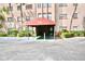 Exterior building entry shows carport with unit number and front door access at 6150 Gulfport S Blvd # 302, Gulfport, FL 33707