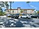 Beautiful building exterior showcasing well-maintained landscaping and convenient parking at 6150 Gulfport S Blvd # 302, Gulfport, FL 33707