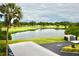 Scenic view of the golf course and pond featuring lush greenery and clear blue skies at 6150 Gulfport S Blvd # 302, Gulfport, FL 33707