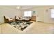 Cozy living room with tile flooring and an area rug at 6150 Gulfport S Blvd # 302, Gulfport, FL 33707