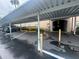 Designated covered parking provides shade for residents' vehicles at this condominium complex at 6150 Gulfport S Blvd # 302, Gulfport, FL 33707