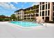 Beautiful outdoor pool area with lounge chairs and manicured landscaping at 6150 Gulfport S Blvd # 302, Gulfport, FL 33707