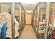 Hallway featuring multiple secure storage units with wire mesh doors at 6150 Gulfport S Blvd # 302, Gulfport, FL 33707