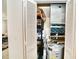 Utility closet with water heater, HVAC system and storage shelves at 6150 Gulfport S Blvd # 302, Gulfport, FL 33707