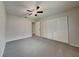 Cozy bedroom with carpeted floors, closet, and ample natural light at 6212 Emerson Dr, New Port Richey, FL 34653
