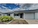 Charming single-story home featuring a one-car garage and well-maintained front yard at 6212 Emerson Dr, New Port Richey, FL 34653