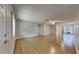 Bright living room with hardwood floors, ceiling fan, and sliding doors at 6212 Emerson Dr, New Port Richey, FL 34653