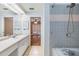 Bathroom featuring a sink, tub, shower head, and doorway to another room at 6436 Huntington Dr, Zephyrhills, FL 33542