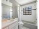 This bathroom has a shower-tub combination and a light grey vanity sink at 6436 Huntington Dr, Zephyrhills, FL 33542