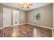 Bedroom with hardwood floors and ensuite bathroom, providing ample space and privacy at 6436 Huntington Dr, Zephyrhills, FL 33542