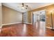 Bedroom with wood floors and views to connecting sun room at 6436 Huntington Dr, Zephyrhills, FL 33542