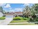 Charming single-story home with a well-maintained lawn and mature landscaping at 6436 Huntington Dr, Zephyrhills, FL 33542