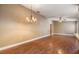Spacious living room with wood floors and a ceiling fan at 6436 Huntington Dr, Zephyrhills, FL 33542