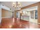 Spacious living room featuring wood floors, a ceiling fan and open floor plan at 6436 Huntington Dr, Zephyrhills, FL 33542