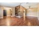 Spacious living room featuring hardwood floors and unique wood accent wall at 6436 Huntington Dr, Zephyrhills, FL 33542