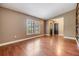 Spacious living room with great natural light and hardwood floors at 6436 Huntington Dr, Zephyrhills, FL 33542