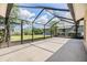 Covered lanai perfect for entertaining, with views of the manicured backyard at 6436 Huntington Dr, Zephyrhills, FL 33542