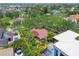 Aerial view showing property lines, landscaping, red-tiled roof, and neighborhood at 750 Alda Ne Way, St Petersburg, FL 33704