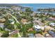 Aerial view of a home surrounded by lush greenery, other residences, and close to the Bay at 750 Alda Ne Way, St Petersburg, FL 33704