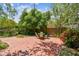 Secluded backyard patio with brick pavers, mature trees, and an outdoor dining area at 750 Alda Ne Way, St Petersburg, FL 33704