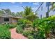 Beautiful landscaping and winding brick path leading to the home's entrance at 750 Alda Ne Way, St Petersburg, FL 33704
