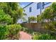 Lush backyard landscaping including stone brick path and mature vegetation at 750 Alda Ne Way, St Petersburg, FL 33704