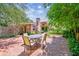 Brick patio offers an inviting outdoor dining area amidst landscaped yard at 750 Alda Ne Way, St Petersburg, FL 33704