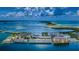 Breathtaking aerial view of the waterfront property with stunning views of the ocean and coastline at 8 Glencoe Pl # 305, Dunedin, FL 34698