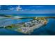 Scenic aerial view of the waterfront community showcasing the building's location and water access at 8 Glencoe Pl # 305, Dunedin, FL 34698
