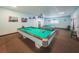 Bright billiards room features two pool tables, creating an ideal space for recreation and entertainment at 8 Glencoe Pl # 305, Dunedin, FL 34698
