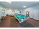Well-lit billiards room with two pool tables, offering a fun and engaging space for residents at 8 Glencoe Pl # 305, Dunedin, FL 34698