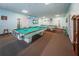 Billiards room featuring two pool tables, perfect for social gatherings and friendly competition at 8 Glencoe Pl # 305, Dunedin, FL 34698