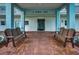 Welcoming building entrance with a covered area and benches providing a comfortable waiting space at 8 Glencoe Pl # 305, Dunedin, FL 34698