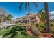 Community office building surrounded by lush landscaping at 8 Glencoe Pl # 305, Dunedin, FL 34698