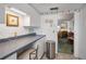 Additional counter space in the kitchen adjacent to the living area at 8 Glencoe Pl # 305, Dunedin, FL 34698