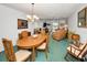 Cozy living and dining area with comfortable furnishings and an open layout at 8 Glencoe Pl # 305, Dunedin, FL 34698