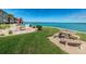 Enjoy outdoor dining in this community space with ample seating, green space, and serene ocean views at 8 Glencoe Pl # 305, Dunedin, FL 34698