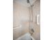 Updated shower with a handheld shower head and grab bars for safety and convenience at 8 Glencoe Pl # 305, Dunedin, FL 34698