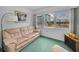 Comfortable sitting area that offers ample natural light with views of the neighborhood at 8 Glencoe Pl # 305, Dunedin, FL 34698