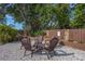 Cozy backyard seating area with comfortable chairs, perfect for relaxing with friends and Gathering at 8240 144Th Ln, Seminole, FL 33776